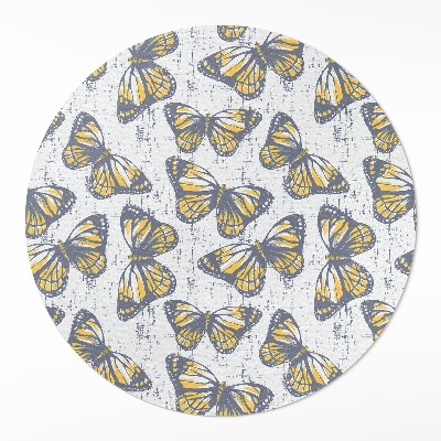 Dywan winylowy okrągły Żółte motyle na teksturze
