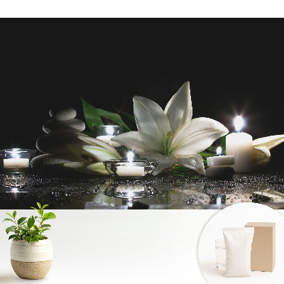 Fototapeta na wymiar do sypialni Lilie z kamieniami i świecami