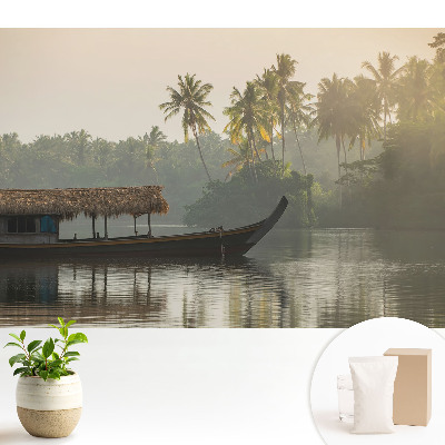 Fototapeta flizelinowa do salonu z motywem mistycznego pejzażu z łodzią i palmami