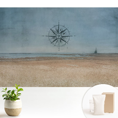 Fototapeta flizelinowa z motywem kompasu na tle morza do salonu