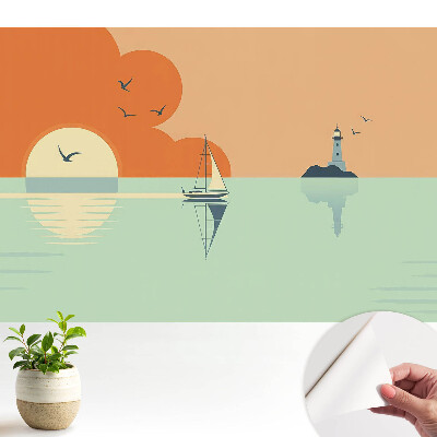 Fototapeta z nadrukiem samoprzylepna Żaglówka i latarnia na tle wschodu słońca