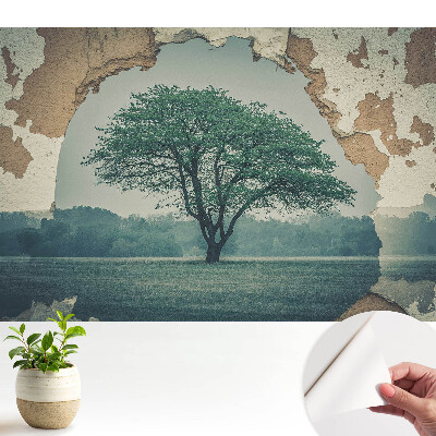 Fototapeta samoprzylepna do salonu Nostalgiczny motyw drzewa na tle starej ściany