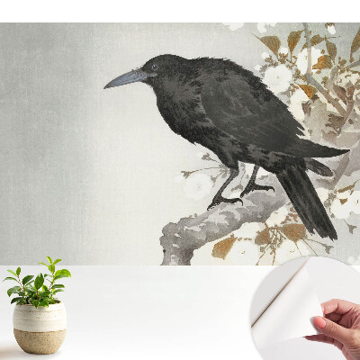 Fototapeta na wymiar do sypialni Subtelny kruk na tle kwitnących gałęzi