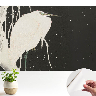 Fototapeta Ptak na gałęzi w zimowy wieczór