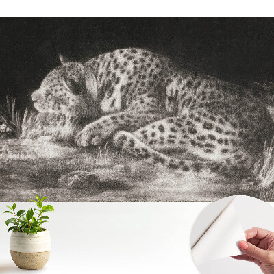 Tapeta fotograficzna samoprzylepna Lampart odpoczywający w trawie