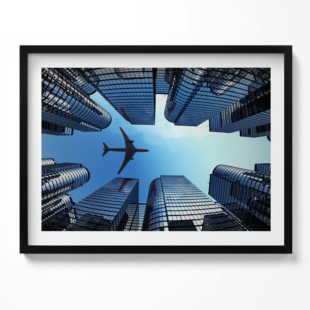 Obraz z ramką Samolot nad budynkami