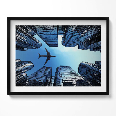 Obraz z ramką Samolot nad budynkami