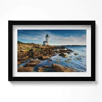 Obraz w ramie Latarnia morska, skały i pejzaż nieba