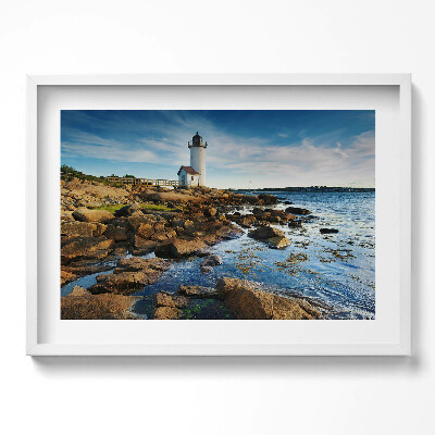 Obraz w ramie Latarnia morska, skały i pejzaż nieba