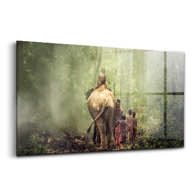 Foto-obraz szklany Dzieci prowadzące słonia